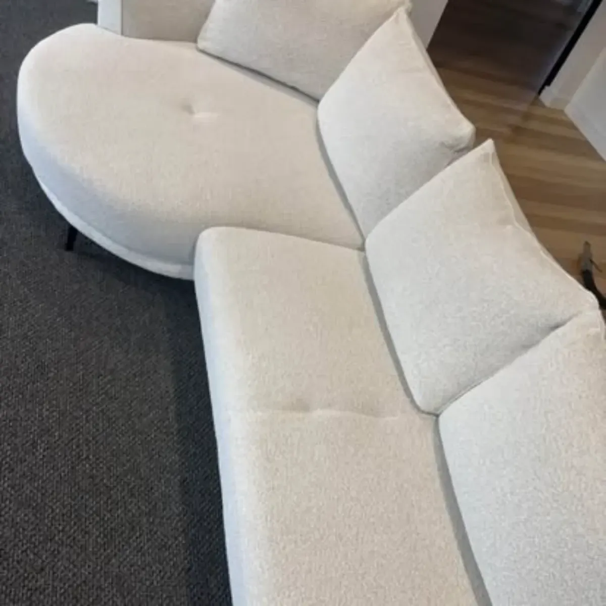 Clean white boucle sofa after professional upholstery cleaning by Shepp City Carpet Cleaning